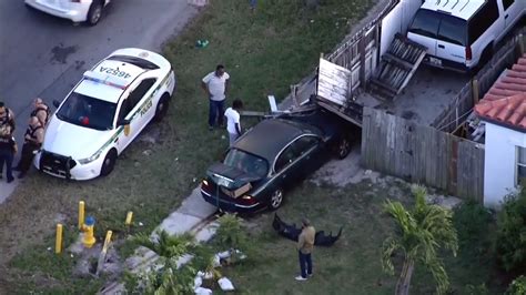 Car slams into fence outside North Miami Beach home; 1 treated for minor injuries